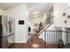 Open-concept interior view highlighting the kitchen, living area, and staircase at 11381 Jay St, Westminster, CO 80020