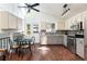 Stylish kitchen with stainless steel appliances, bright lighting and breakfast table with chairs at 11381 Jay St, Westminster, CO 80020
