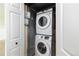 The practical laundry area boasts a stacked washer and dryer for efficient space utilization and ease at 11381 Jay St, Westminster, CO 80020