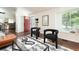 Inviting living room features stylish black chairs, modern rug, and bright natural light at 11381 Jay St, Westminster, CO 80020