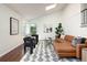 Comfortable living room showcases a leather sectional sofa, patterned rug, and vaulted ceiling at 11381 Jay St, Westminster, CO 80020