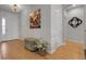 Hallway with hardwood floors and stylish decor at 1033 Bramblewood Dr, Castle Pines, CO 80108