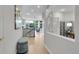 Bright hallway with hardwood floors and open access to living area at 1033 Bramblewood Dr, Castle Pines, CO 80108