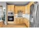 Updated kitchen featuring stainless steel appliances, wood cabinets and quartz countertops at 1033 Bramblewood Dr, Castle Pines, CO 80108