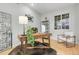 Bright office with a modern desk, stylish chair, and natural light at 1033 Bramblewood Dr, Castle Pines, CO 80108