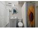 Bathroom in basement with shower, toilet and sink at 1909 Iola St, Aurora, CO 80010