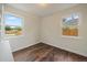 Bedroom with laminate flooring and views of back and side yards at 1909 Iola St, Aurora, CO 80010
