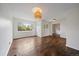 Spacious living room featuring dark laminate floors and a bright, open floor plan at 1909 Iola St, Aurora, CO 80010