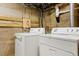 Laundry area featuring a modern washer and dryer set, along with ample space at 4210 S Fox St, Englewood, CO 80110