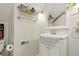 Bathroom featuring a classic vanity, storage, and a modern mirror at 4210 S Fox St, Englewood, CO 80110