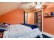 Inviting bedroom featuring neutral decor and a sloped ceiling at 4210 S Fox St, Englewood, CO 80110