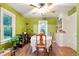 Dining room with natural light, hardwood floors, and built-in storage at 4210 S Fox St, Englewood, CO 80110
