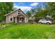 Charming single-story home with a manicured lawn, lush landscaping, and a cozy front porch at 4210 S Fox St, Englewood, CO 80110