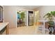 Charming kitchen with tile floors, adjacent dining area, and stainless steel refrigerator at 4210 S Fox St, Englewood, CO 80110