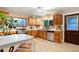 Charming kitchen featuring wood cabinets and updated stainless steel appliances at 4210 S Fox St, Englewood, CO 80110