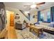 Cozy living room with hardwood floors, area rug, and comfortable seating at 4210 S Fox St, Englewood, CO 80110