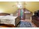 Bedroom with hardwood floors, ceiling fan, and a private balcony entrance at 4210 S Fox St, Englewood, CO 80110