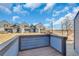 Relaxing back deck offers a private outdoor space with views of the surrounding landscape at 8911 W Yale Ave, Lakewood, CO 80227