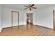 Bedroom with wood floors and a double door closet provides ample storage space for an organized living area at 8911 W Yale Ave, Lakewood, CO 80227