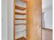 Linen closet with built-in shelves provides ample storage space, ensuring a clutter-free and organized living area at 8911 W Yale Ave, Lakewood, CO 80227