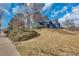 Charming multi-level home with beautiful landscaping and mature trees at 8911 W Yale Ave, Lakewood, CO 80227