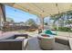 Inviting backyard with patio furniture, fire pit, and shade canopy for outdoor relaxation at 7080 Beach St, Westminster, CO 80030