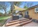 Outdoor deck area featuring comfortable seating, fire pit, and shade canopy at 7080 Beach St, Westminster, CO 80030