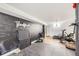 Basement gym space with custom chalkboard wall, fitness equipment, and padded flooring at 7080 Beach St, Westminster, CO 80030