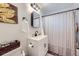 Charming bathroom with a shower-tub combination, modern vanity, and tasteful decorative accents at 7080 Beach St, Westminster, CO 80030
