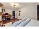 Inviting bedroom features hardwood floors, a guitar, and a comfortable workspace with modern lighting at 7080 Beach St, Westminster, CO 80030