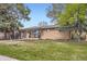 Inviting brick home with a manicured lawn and an appealing exterior, complemented by mature trees at 7080 Beach St, Westminster, CO 80030
