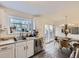 Bright kitchen featuring modern appliances, eat-in area, and access to an outdoor patio at 7080 Beach St, Westminster, CO 80030