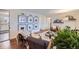 Bright living room with hardwood floors, neutral decor, and access to the kitchen at 7080 Beach St, Westminster, CO 80030