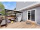 Spacious back deck featuring a gazebo, outdoor seating, and sliding glass doors to the home at 23 S Nome St # A, Aurora, CO 80012