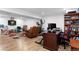Open basement with hardwood floors and multiple activity areas at 23 S Nome St # A, Aurora, CO 80012