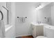 Bright bathroom featuring a sink, toilet, and towel rack at 23 S Nome St # A, Aurora, CO 80012