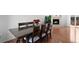 A formal dining room features hardwood floors and a view of the fireplace at 23 S Nome St # A, Aurora, CO 80012