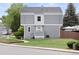 Exterior elevation featuring the townhome, front lawn and tidy landscaping at 23 S Nome St # A, Aurora, CO 80012