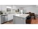 Bright kitchen featuring stainless steel appliances, a center island, and windows for natural light at 23 S Nome St # A, Aurora, CO 80012