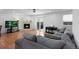 Spacious living room with hardwood floors, fireplace, and a walk-out to the backyard at 23 S Nome St # A, Aurora, CO 80012