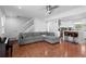 Spacious living room featuring a large sectional sofa and stairs at 23 S Nome St # A, Aurora, CO 80012