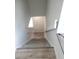 Bright stairway with light-colored wood stairs and white trim, offering a modern, clean aesthetic at 23 S Nome St # A, Aurora, CO 80012