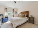 Inviting bedroom with a cozy reading chair, natural light, and a comfortable bed at 10155 Riverstone Dr, Parker, CO 80134