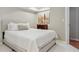 Cozy bedroom features a queen size bed, neutral colors, and a decorative art piece at 10155 Riverstone Dr, Parker, CO 80134
