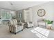 Inviting living room with neutral tones, comfortable seating, built-in shelving, and natural light, creating a cozy atmosphere at 10155 Riverstone Dr, Parker, CO 80134