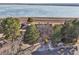 Aerial view of townhomes near a serene lake, showing the desirable location at 7000 W Stetson Pl # 9, Littleton, CO 80123