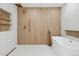 Modern bathroom featuring a soaking tub, walk-in shower and sleek gold fixtures at 7000 W Stetson Pl # 9, Littleton, CO 80123