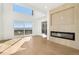 Spacious living room featuring large windows, modern fireplace, and sliding glass doors to the deck at 7000 W Stetson Pl # 9, Littleton, CO 80123