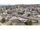 A birds-eye view of a suburban area with single-Gathering homes, landscaping, and quiet streets at 1206 Baldwin Park Cir, Castle Rock, CO 80104