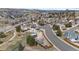 Scenic aerial view of a neighborhood showing rooftops, roads, and surrounding landscapes at 1206 Baldwin Park Cir, Castle Rock, CO 80104